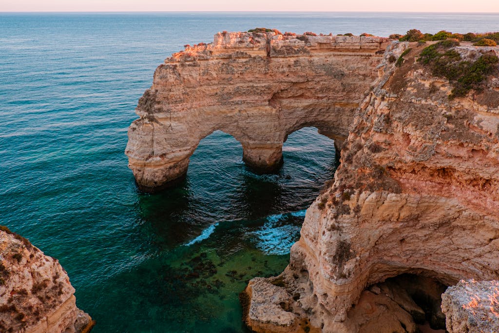 Stunning Algarve cliffs at sunset, showcasing Portugal's natural beauty.